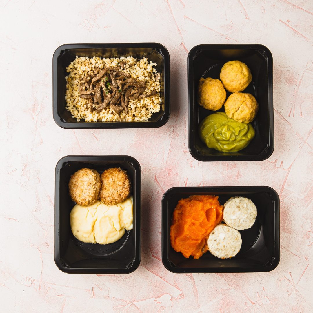 Healthy food and diet concept, restaurant dish delivery. Food take away in plastic boxes with cutlery, vegetable salads and meat top view, flat lay. Fitness food. Eating right concept, healthy food.