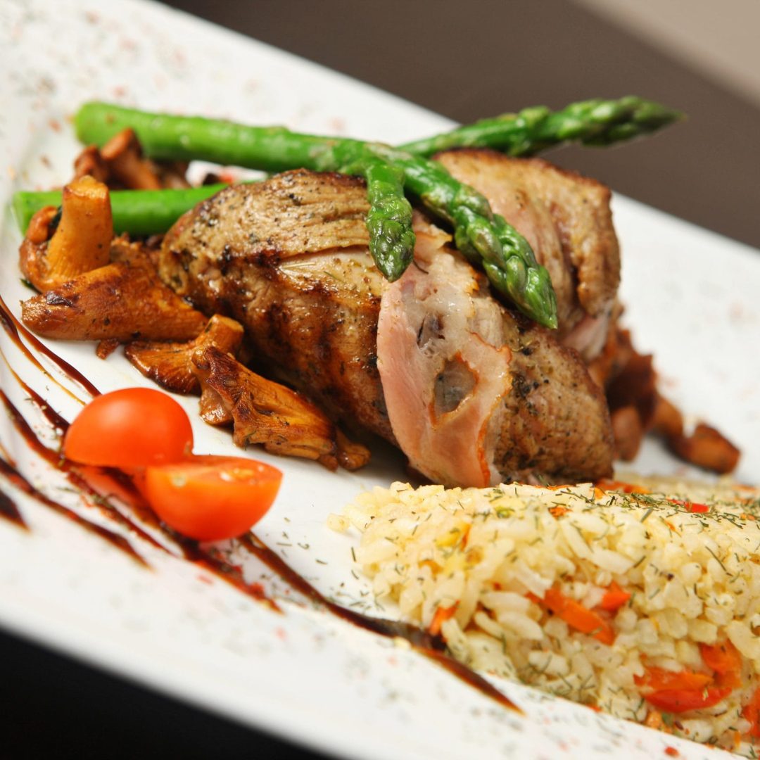 grilled meat with mushrooms and rice with vegetables